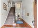 Grand foyer with hardwood floors, staircase, elegant decor, and ample natural light at 3720 Harts Pl, Atlanta, GA 30341