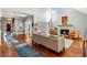 Spacious living room with high ceilings, a fireplace, and hardwood floors at 3720 Harts Pl, Atlanta, GA 30341