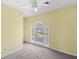 Cozy bedroom with a carpet, a window, and yellow walls at 820 Hounds Ridge Ct, Lawrenceville, GA 30043