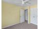 This is a neutral bedroom with neutral carpet and painted in a light cream color at 820 Hounds Ridge Ct, Lawrenceville, GA 30043