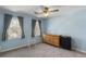 Bright bedroom with two windows and wooden dresser at 820 Hounds Ridge Ct, Lawrenceville, GA 30043