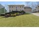 Charming two-story home featuring a well-manicured lawn, a two-car garage, and mature landscaping at 820 Hounds Ridge Ct, Lawrenceville, GA 30043