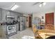 Updated kitchen featuring granite countertops, stainless steel appliances, and tiled flooring at 820 Hounds Ridge Ct, Lawrenceville, GA 30043