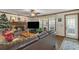 Cozy living room features a fireplace, hardwood floors, and natural light at 820 Hounds Ridge Ct, Lawrenceville, GA 30043