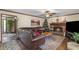 Comfortable living room with hardwood floors, brick fireplace, and large leather sofa at 820 Hounds Ridge Ct, Lawrenceville, GA 30043