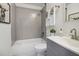 Updated bathroom features a shower-tub combo with gray subway tiles, a gray vanity, and modern fixtures at 862 Gaston Sw St, Atlanta, GA 30310