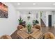 Dining room boasts modern decor with seating for four with stairs and living room in view at 862 Gaston Sw St, Atlanta, GA 30310