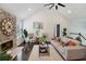 Bright living room with stone fireplace, vaulted ceilings, ceiling fan, and hardwood floors at 862 Gaston Sw St, Atlanta, GA 30310