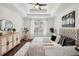 Bright main bedroom with tray ceilings, ceiling fan, hardwood floors, and neutral colors at 862 Gaston Sw St, Atlanta, GA 30310