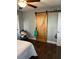 Bedroom featuring a striking barn door and hardwood floors at 2611 Huntingdon Chase, Atlanta, GA 30350