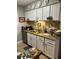 Functional kitchen with white cabinetry, modern appliances, and ample counter space at 2611 Huntingdon Chase, Atlanta, GA 30350