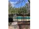 Community pool featuring a green cover and black fence at 2611 Huntingdon Chase, Atlanta, GA 30350