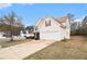 Charming two-story home featuring an attached two car garage and well maintained lawn on a sunny day at 345 Timberlake Ter, Covington, GA 30016