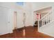 Bright foyer featuring hardwood floors, a staircase, and a soaring ceiling with skylight at 345 Timberlake Ter, Covington, GA 30016