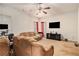 Comfortable living room with carpet, large windows and large screen tv on the wall at 345 Timberlake Ter, Covington, GA 30016