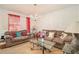 Comfortable living room with carpet, bright natural light, and traditional chandelier at 345 Timberlake Ter, Covington, GA 30016