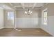 Elegant dining room with decorative ceiling, hardwood floors, and a large window at 5604 Meadowstone Walk, Kennesaw, GA 30152