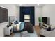 Cozy bedroom featuring a large window with blue curtains and a comfortable sitting area at 2219 Nena Way # 22, Tucker, GA 30084