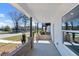 Charming covered porch with brick accents and ample space at 2219 Nena Way # 22, Tucker, GA 30084