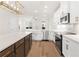 Bright kitchen features white cabinets, stainless steel appliances, and a large island with quartz countertops at 2219 Nena Way # 22, Tucker, GA 30084