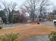 Residential street view showcasing the surrounding neighborhood with well maintained yards and mature trees at 279 Valley Rd, Lawrenceville, GA 30044