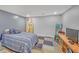 Finished basement bedroom with a comfortable bed and surfboard decor, providing a unique space at 3916 Loch Highland Ne Pass, Roswell, GA 30075