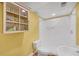 Basement bathroom featuring a shower and built-in shelving offering practical storage solutions at 3916 Loch Highland Ne Pass, Roswell, GA 30075