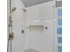Modern bathroom with white subway tile, bronze shower fixtures, and a built-in shower seat at 3916 Loch Highland Ne Pass, Roswell, GA 30075