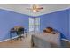 Bright bedroom features a desk by the windows and a bed at 3916 Loch Highland Ne Pass, Roswell, GA 30075