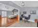Bright bedroom with wood floors and a desk area, offering a functional and stylish living space at 3916 Loch Highland Ne Pass, Roswell, GA 30075