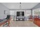 Bright bonus room with lots of natural light, desk, and television at 3916 Loch Highland Ne Pass, Roswell, GA 30075