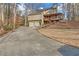 Charming two-story home with a spacious front yard, two-car garage, and front porch at 3916 Loch Highland Ne Pass, Roswell, GA 30075
