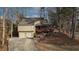 Exterior front of house, two-car garage, porch, landscaping, and stone steps at 3916 Loch Highland Ne Pass, Roswell, GA 30075