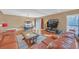 Bright living room with wood floors, tan walls, fireplace, and a dining area in the background at 3916 Loch Highland Ne Pass, Roswell, GA 30075