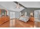 Cozy primary bedroom featuring hardwood floors, great light, and ample storage space at 3916 Loch Highland Ne Pass, Roswell, GA 30075