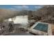 Waterfront community featuring an outdoor pool, sundeck, and beautiful lake views at 3916 Loch Highland Ne Pass, Roswell, GA 30075