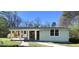 Charming single-story home featuring a covered porch with stone accents and a well-maintained front yard at 6886 Upshaw Mill Rd, Douglasville, GA 30134
