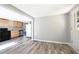 Open kitchen featuring wood-look flooring, stainless steel appliances, and a bright, airy feel with neutral colors at 6886 Upshaw Mill Rd, Douglasville, GA 30134