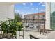 Relaxing outdoor balcony with seating and views of trees and a brick apartment complex at 531 Burton Dr, Alpharetta, GA 30009