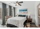 Cozy bedroom with large window, ceiling fan, comfortable bed, and ensuite bathroom at 531 Burton Dr, Alpharetta, GA 30009