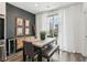 Contemporary dining area with modern table, bench, stylish lighting, and decorative wall art at 531 Burton Dr, Alpharetta, GA 30009