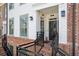 Charming townhome entrance featuring brick stairs and classic exterior design at 531 Burton Dr, Alpharetta, GA 30009
