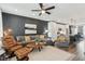 Open-concept living room with modern furniture and a view of the adjacent kitchen at 531 Burton Dr, Alpharetta, GA 30009