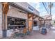 Outdoor seating area at Truck & Tap, featuring a brick facade, wooden accents, and a welcoming atmosphere at 531 Burton Dr, Alpharetta, GA 30009