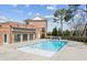 Community swimming pool with a brick building, black awning, and lounge seating area at 531 Burton Dr, Alpharetta, GA 30009