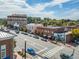 Street view of a charming downtown area with a crosswalk, local businesses, and apartments on a sunny day at 531 Burton Dr, Alpharetta, GA 30009
