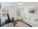 Inviting room with natural light and workout equipment with access to a balcony at 531 Burton Dr, Alpharetta, GA 30009