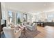 Stylish living room with modern furniture, a cozy fireplace, and an open layout connected to the kitchen area at 245 Roycroft Ln, Fayetteville, GA 30214
