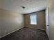 A cozy bedroom featuring neutral walls, plush carpet and a window with blinds at 287 Bramlett Meadows Dr, Douglasville, GA 30134