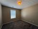 A cozy bedroom featuring neutral walls, plush carpet and a window with blinds at 287 Bramlett Meadows Dr, Douglasville, GA 30134
